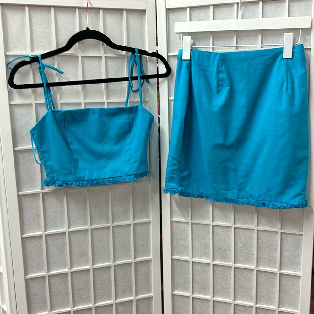 Blue Blush small turquoise fringed crop top and skirt set. Like new